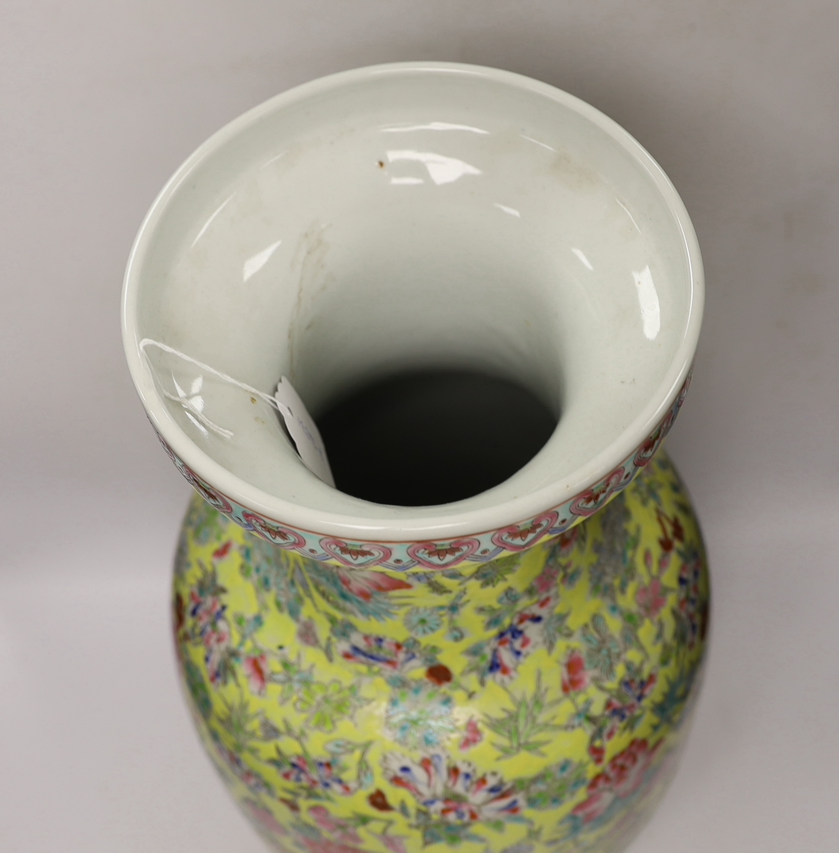 A large Chinese famille rose yellow ground baluster vase, 62cm high